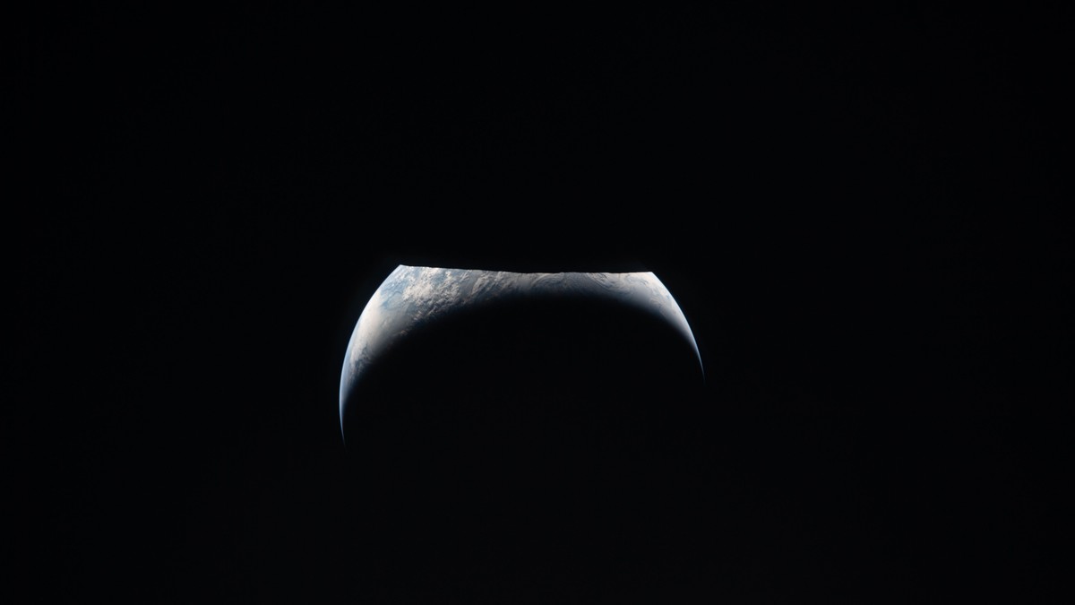 Earth rising as a thin blue crescent above the dark lunar horizon, photographed from the Orion spacecraft during the Artemis II mission