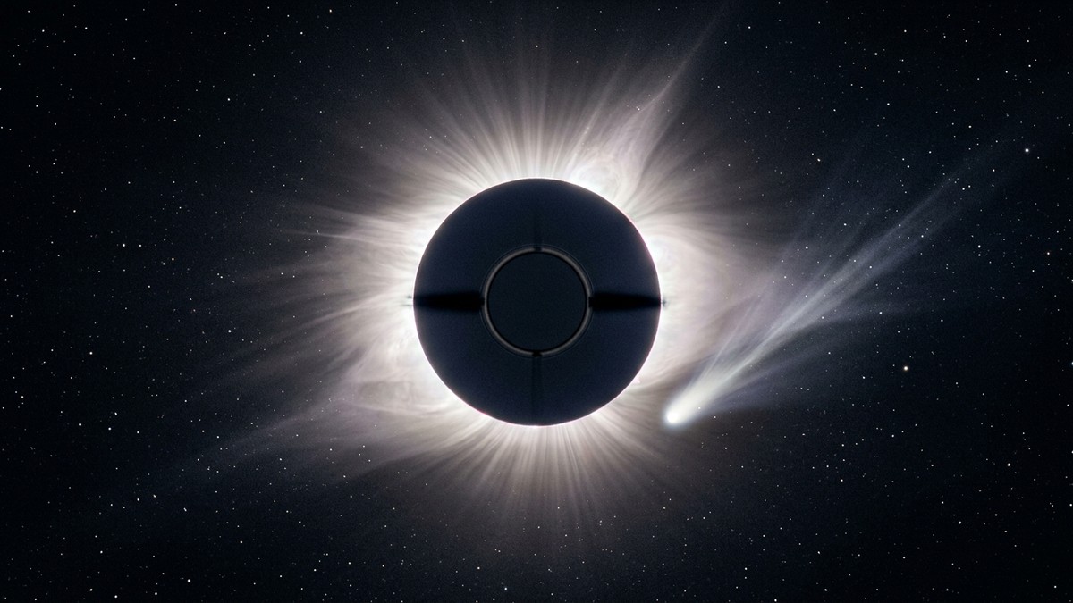 A coronagraph image showing the Sun blocked by a dark disc with a bright comet trail fading into a diffuse smear near the solar corona