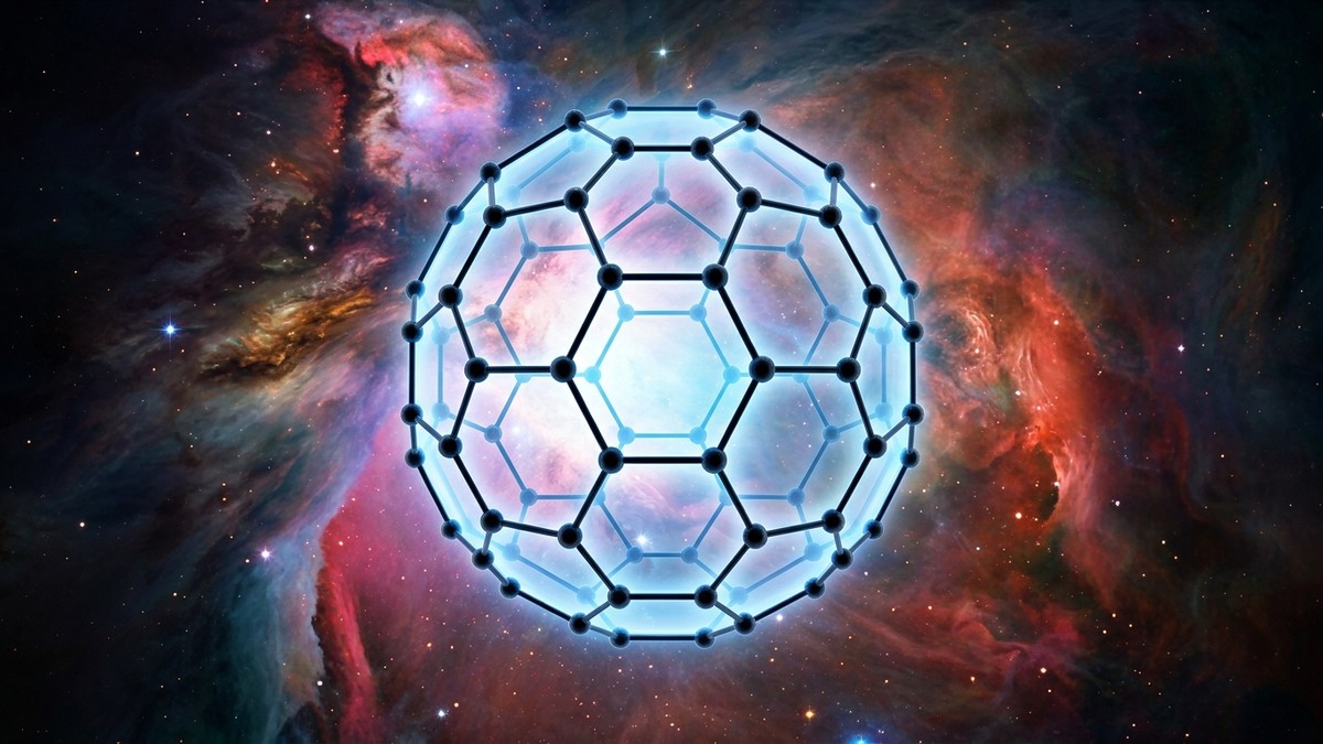 Artistic representation of a C60 buckyball molecule, a hollow sphere of carbon atoms with hexagonal and pentagonal faces, glowing against a nebula background