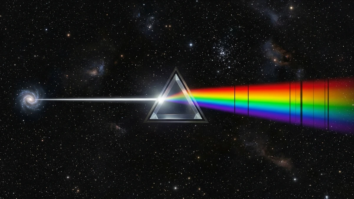 A beam of galaxy light spread into a colourful spectrum with dark absorption lines revealing the fingerprints of different star types