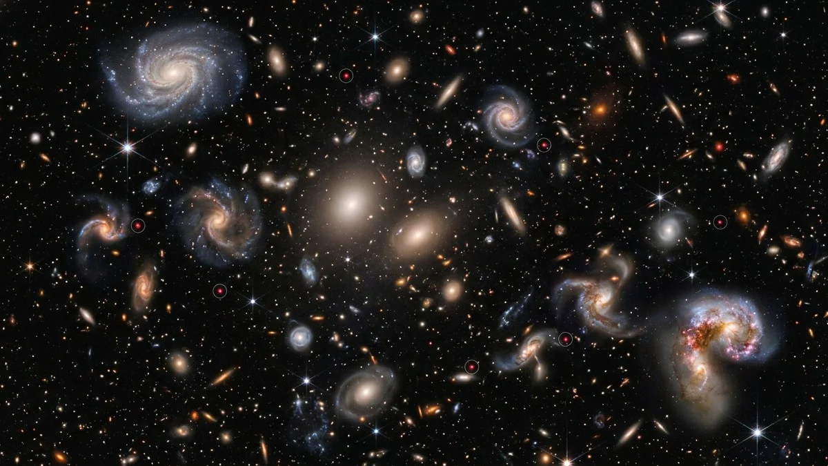 JWST deep field image showing countless early-universe galaxies with arrows highlighting compact red point sources among them