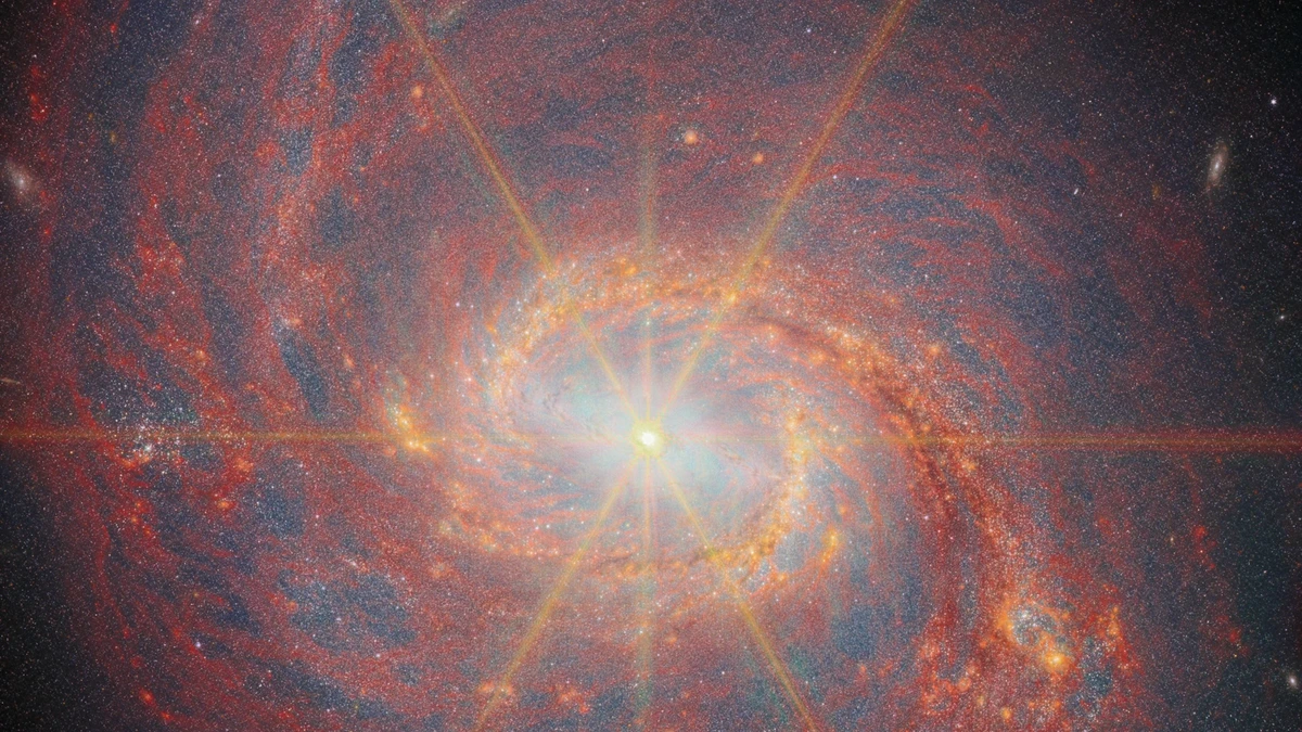 Full James Webb Space Telescope NIRCam view of barred spiral galaxy M77 (NGC 1068), showing the spiral arms, galactic bar, star-forming regions, and blazing nucleus