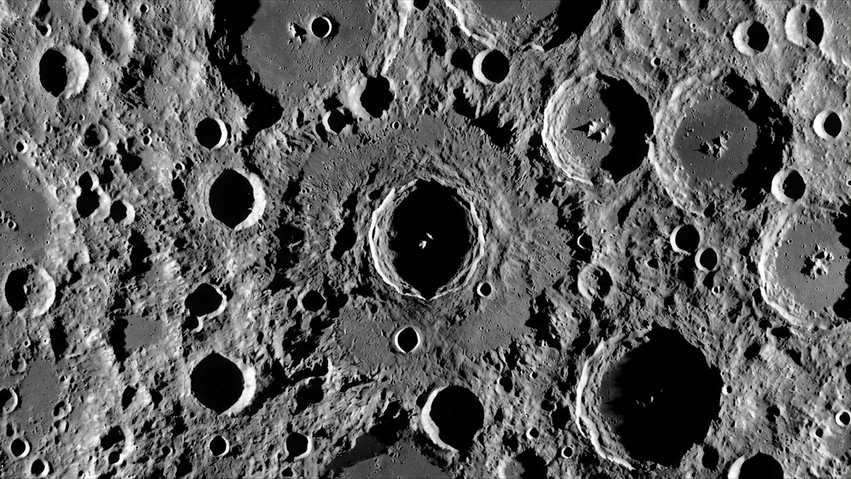 Map of the lunar south pole region showing permanently shadowed craters, peaks of eternal light, and China's Chang'e mission target landing sites