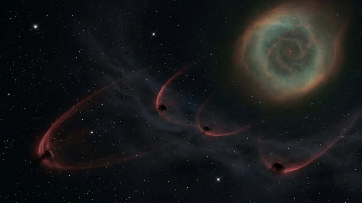 Faint glowing arcs of red hydrogen gas curving around dark invisible clumps of stellar debris in the outer region of the Helix Nebula