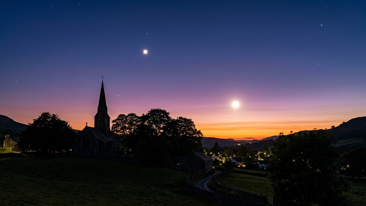 Venus and Jupiter visible in the evening twilight sky over a rural landscape