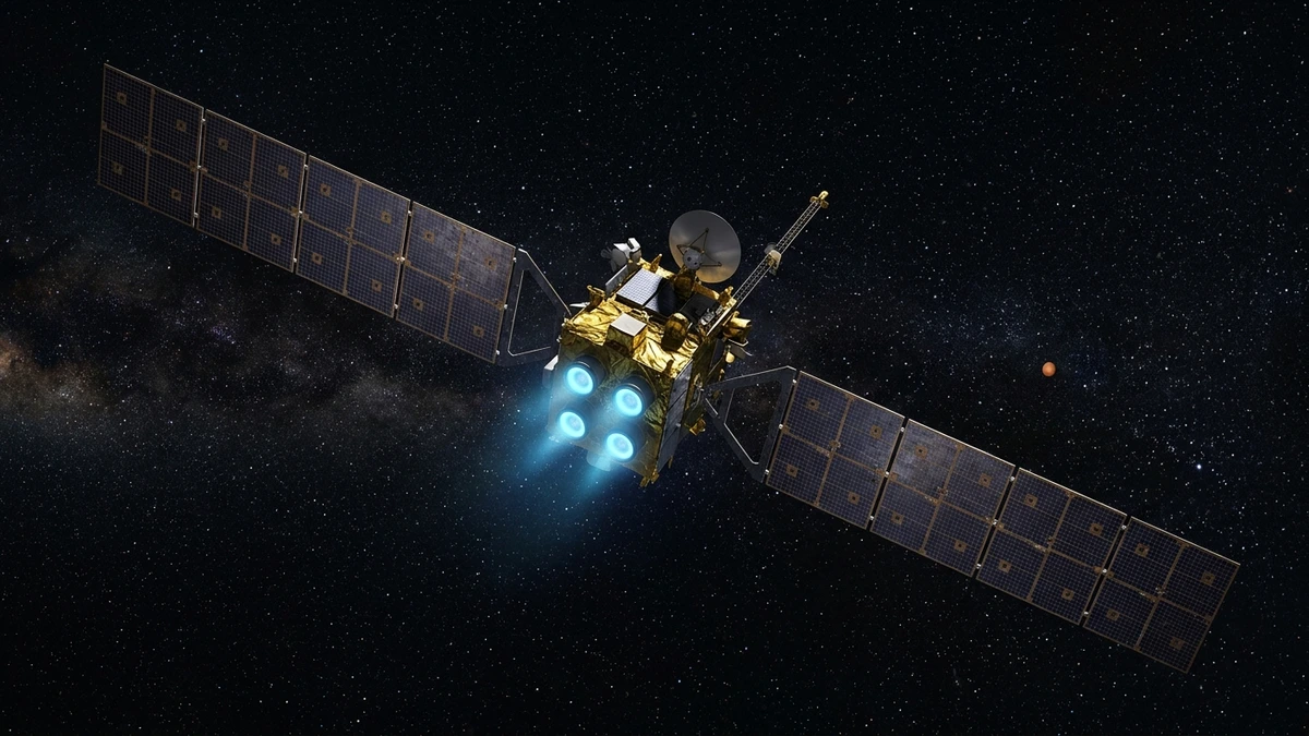 NASA's Psyche spacecraft in deep space with solar panels extended and ion thrusters glowing blue