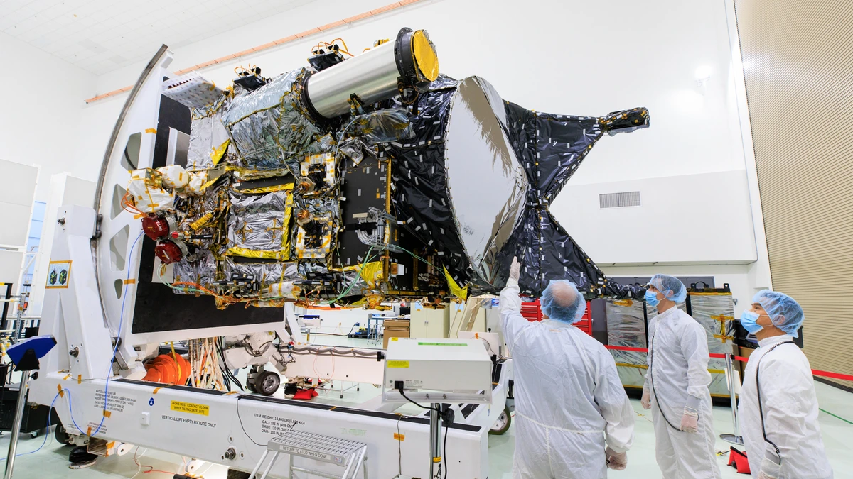 NASA's Psyche spacecraft in the clean room at Kennedy Space Center before launch, showing its large rectangular solar panels and science instruments