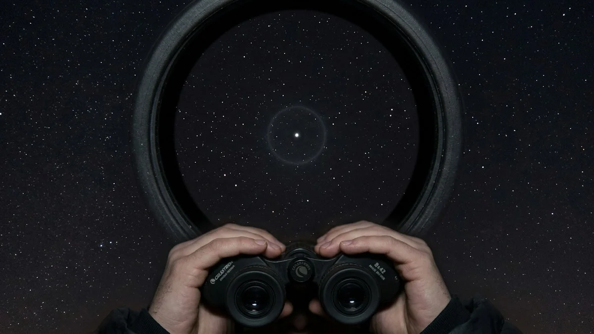 View of the night sky through binoculars showing the region of Libra where Vesta is located, with the asteroid marked