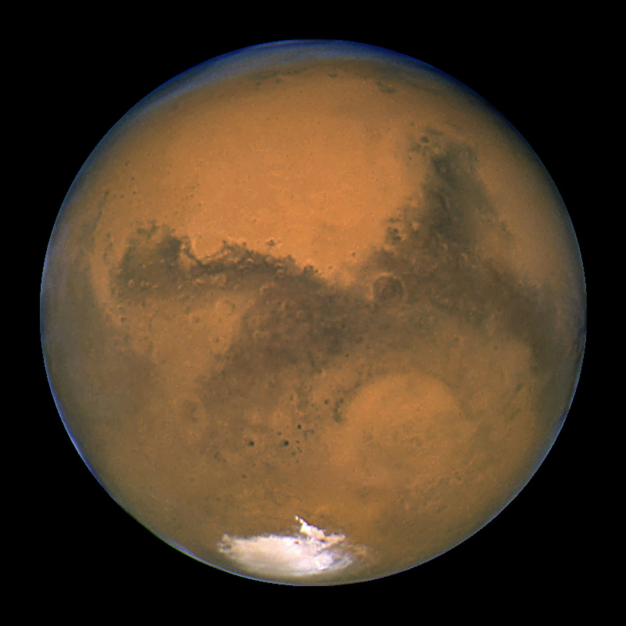 Mars photographed by the Hubble Space Telescope at closest approach in August 2003 — the sharpest view ever taken of the Red Planet from Earth orbit