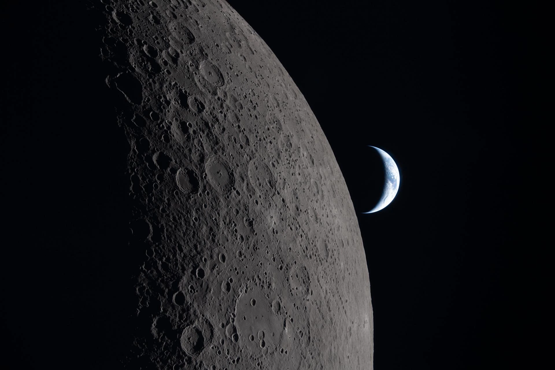 The far side of the Moon photographed by the Artemis II crew in April 2026, showing the heavily cratered ancient highlands with no dark maria visible