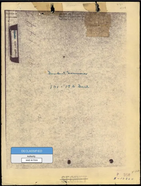 A file cover with notes and a declassification sticker.