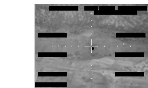 Redacted sensor image with a crosshair targeting an object.