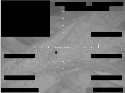 Redacted sensor image with a crosshair targeting an object.
