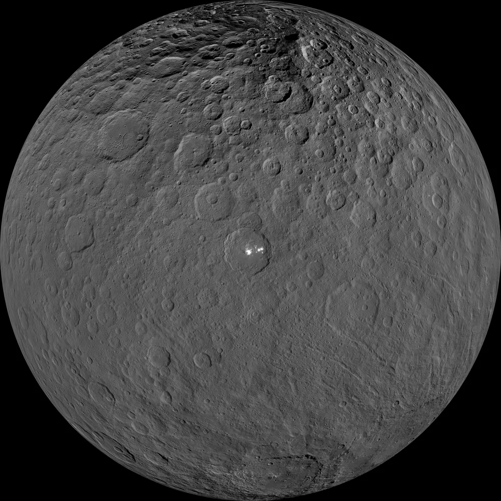 Full disc of dwarf planet Ceres photographed by NASA's Dawn spacecraft, centred on Occator Crater with its bright salt spots near the middle